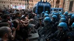 Dozens hurt in Bologna protests after man dies while being restrained by police