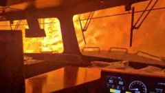 Dramatic video shows wildfire surround freight train in Canada