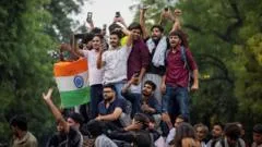 India's 'cockroach' protest called off after education minister quits
