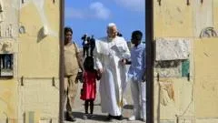 Pope urges Europe to do more for migrants while visiting gateway island