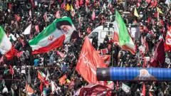 Huge crowds in Mashhad as Iran's late supreme leader is buried