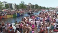 Crowds line Amsterdam's canals for Pride boat parade