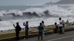 East Asia braces for destructive typhoon as landslides kill 15 in Philippines