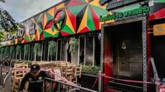 Death toll from Bangkok bar fire rises to 30 as police probe safety lapses